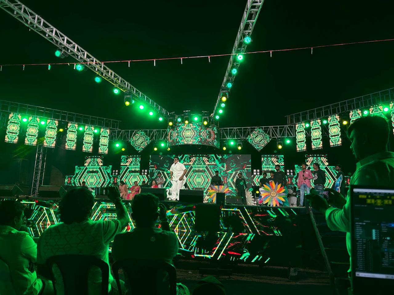 Green-lit outdoor concert with LED panels and live performance stage production in Bangalore