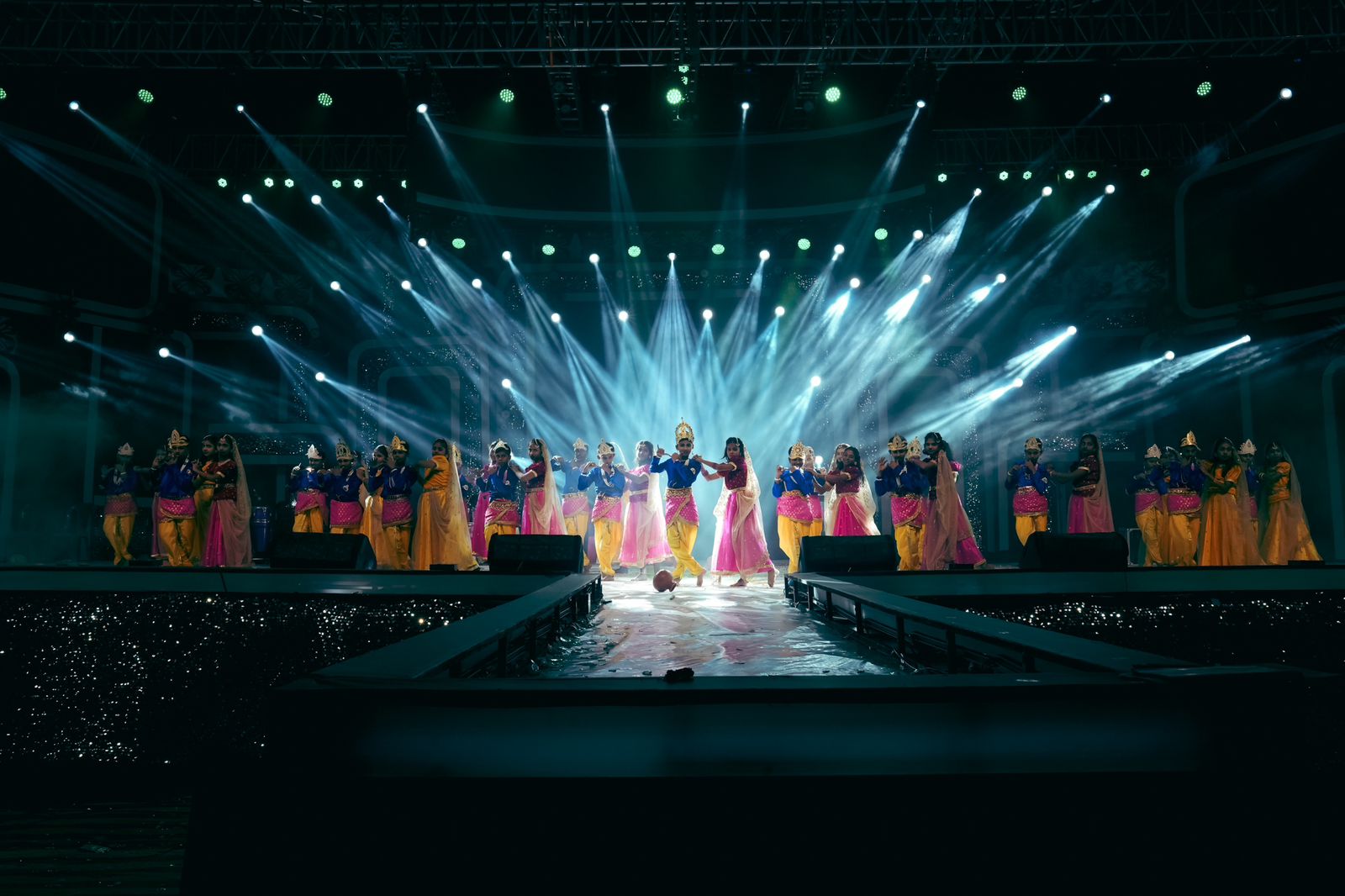 Dance performance with spectacular white beam lighting and stage production for cultural event in Bangalore