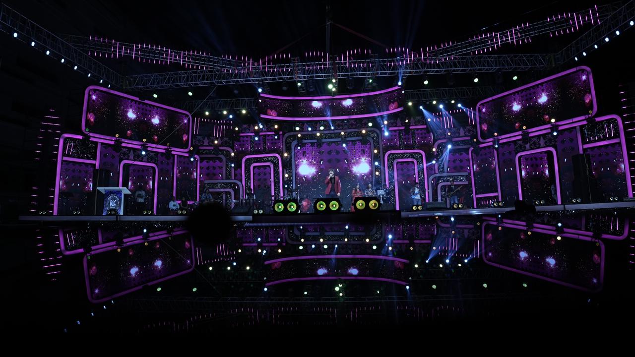 Live music concert with purple LED stage design and professional sound system setup by Supreme Media Productions