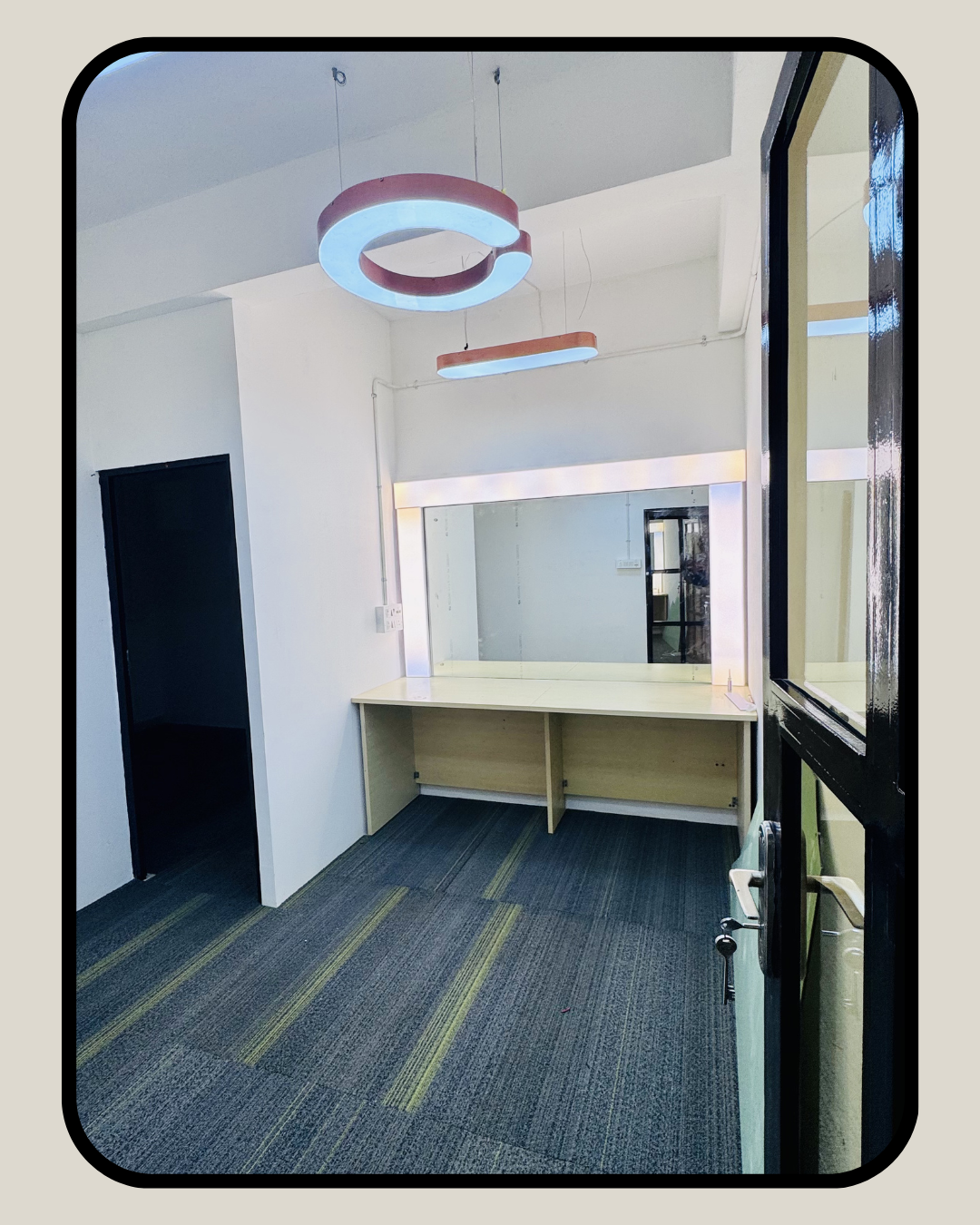 Private office workspace with modern pendant lighting at Supreme Media Productions Bangalore