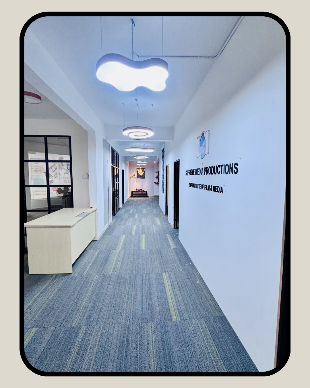 Supreme Media Productions office hallway with modern interior design at Vidyaranyapura Bengaluru