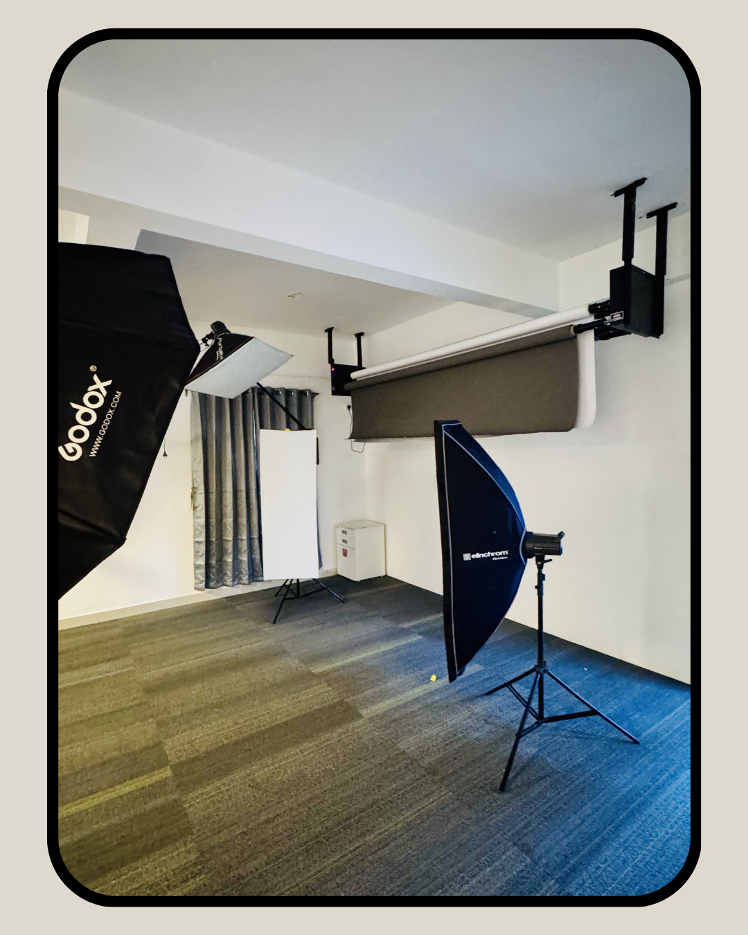 Production studio with Godox softbox lights and ceiling-mounted backdrop system in Vidyaranyapura