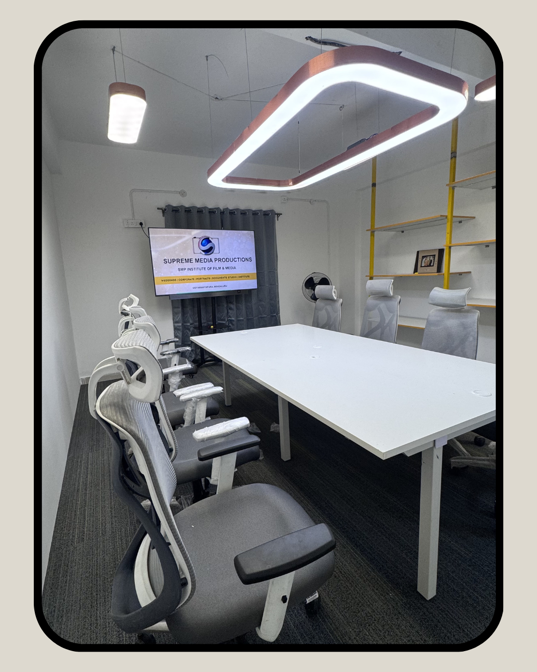 Conference room with ergonomic seating and presentation setup at SMP event production office Bangalore