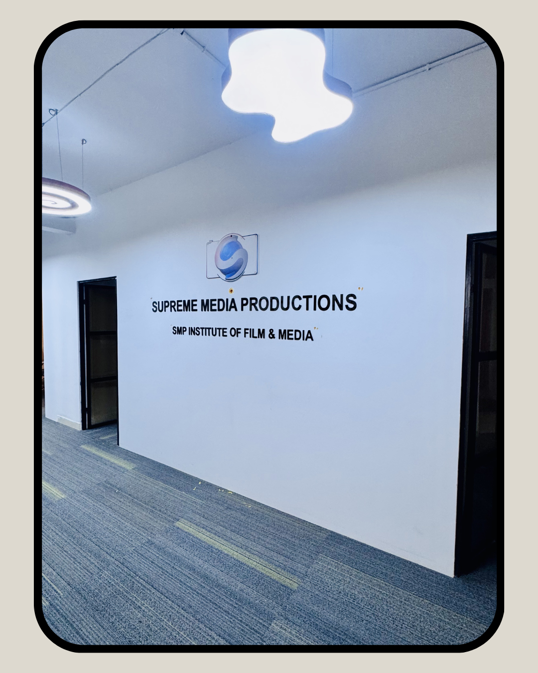 Office entrance featuring Supreme Media Productions and SMP Institute of Film and Media branding